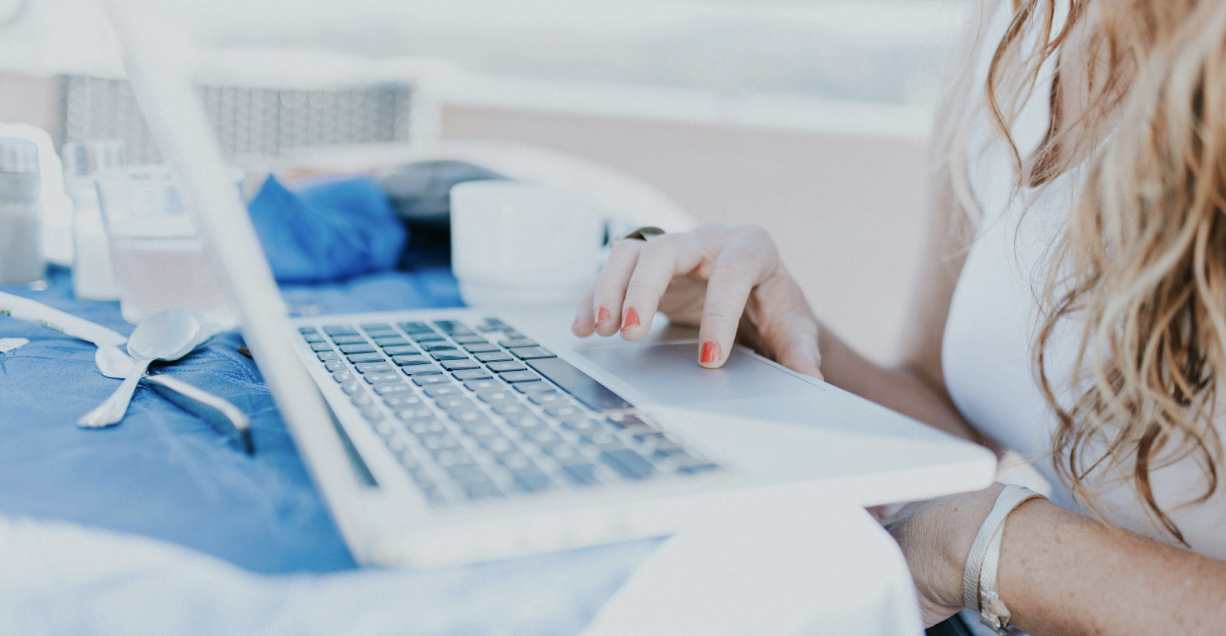 Woman typing on laptop; Telemedicine Decoded